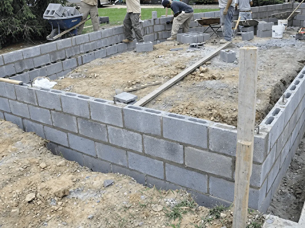 Professionals building a foundation with blocks in Arlington, TX